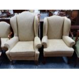 TWO WING ARM CHAIRS UPHOLSTERED IN OATMEAL MATERIAL