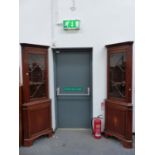 A PAIR OF SATIN WOOD BANDED MAHOGANY CORNER CUPBOARDS, EACH WITH THE UPPER HALF ASTRAGAL GLAZED