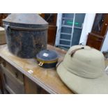 A PITH HELMET WITH TIN BOX AND A SPICE TIN