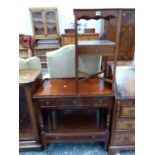 A MAHOGANY TWO TIER SIDE CABINET WITH WAVY GALLERIED TOP AND FOUR DRAWERS TOGETHER WITH A MAHOGANY