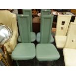 A SET OF FOUR GREEN LEATHER TALL BACKED CHAIRS