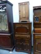 AN OAK BEDSIDE CUPBOARD TOGETHER WITH A MORE MODERN OAK DRINKS CABINET. W 70 x D 43 x H 124cms.