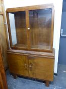 AN ART DECO MAHOGANY DISPLAY CABINET, THE BASE DOORS PANELLED