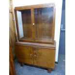 AN ART DECO MAHOGANY DISPLAY CABINET, THE BASE DOORS PANELLED