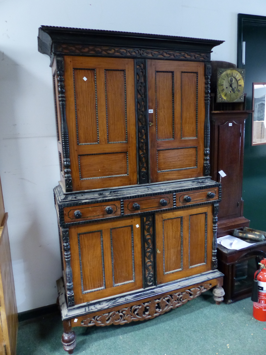 A DUTCH HARDWOOD AND EBONY SIDE CABINET WITH CUPBOARDS ABOVE AND BELOW THREE CENTRAL DRAWERS. W