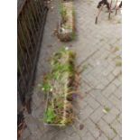 A PAIR OF CONCRETE RECTANGULAR SHAPED PLANTERS