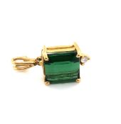 A GREEN TOURMALINE AND DIAMOND PENDANT. THE STEP CUT TOURMALINE APPROX 8 X 7mm. DROP INCLUDING