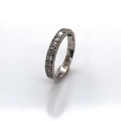 AN ANTIQUE DIAMOND HALF ETERNITY RING. TWELVE OLD CUT DIAMONDS APPROX WEIGHT EACH 0.05cts, TOTAL