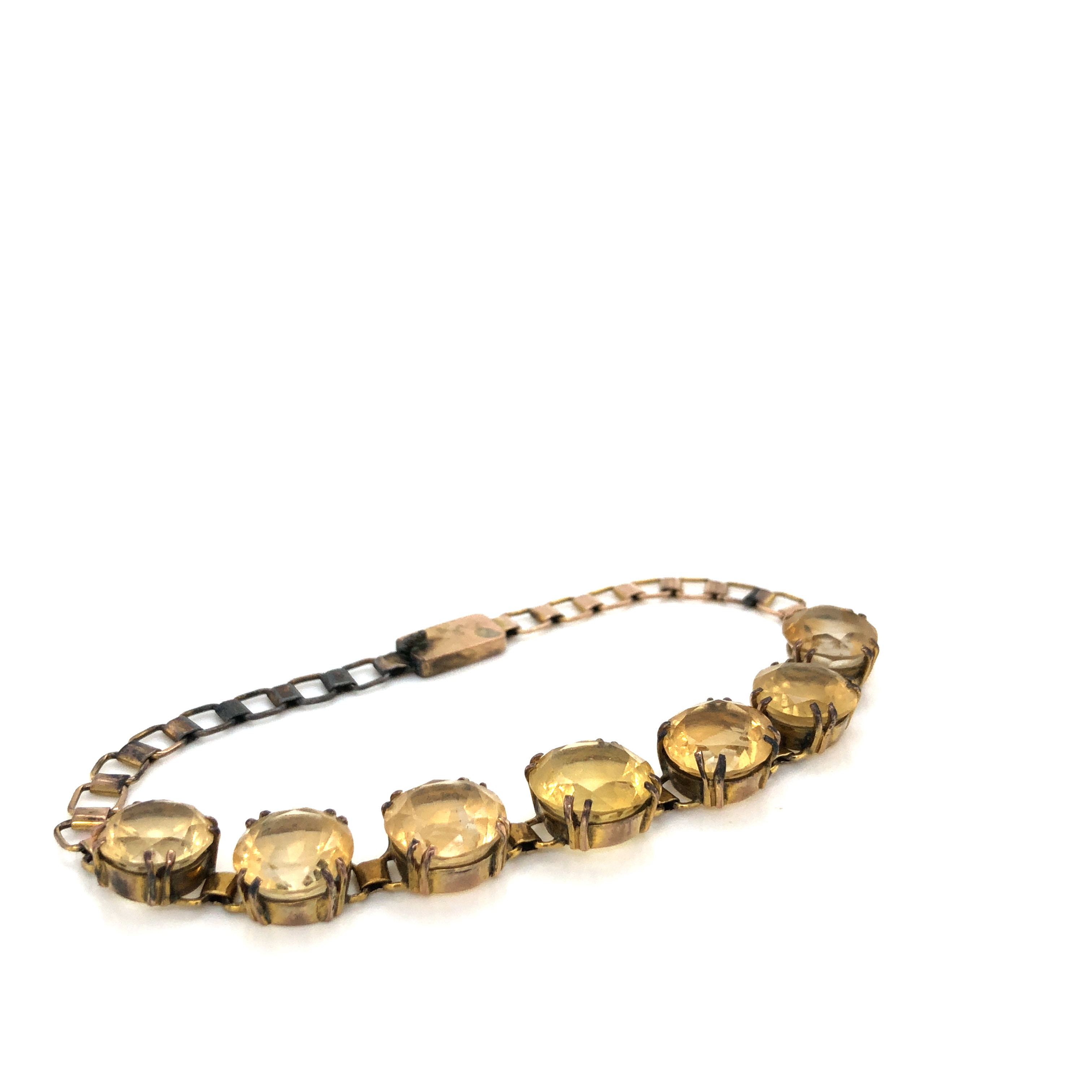 A VINTAGE CITRINE QUARTZ COSTUME BRACELET. FEATURING SEVEN GRADUATED CITRINE'S IN DOUBLE FOUR CLAW - Image 2 of 3