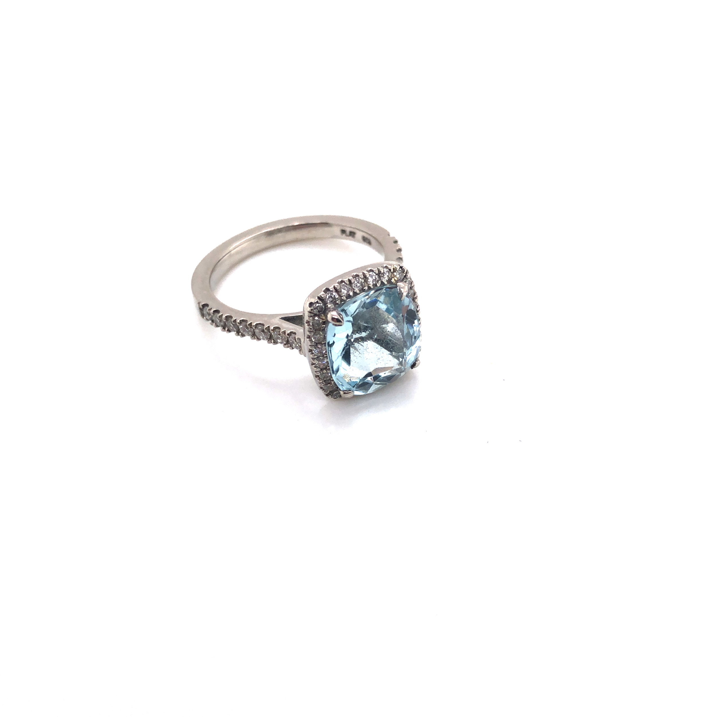 A CUSHION CUT AQUAMARINE AND DIAMOND HALO RING. THE SHANK STAMPED PLAT 950, AND ASSESSED AS - Image 2 of 7