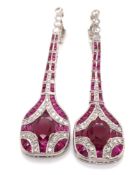 A PAIR OF ART DECO STYLE ARTICULATED DROP RUBY AND DIAMOND PENDANT EARRINGS. THE PRINCIPLE OVAL RUBY