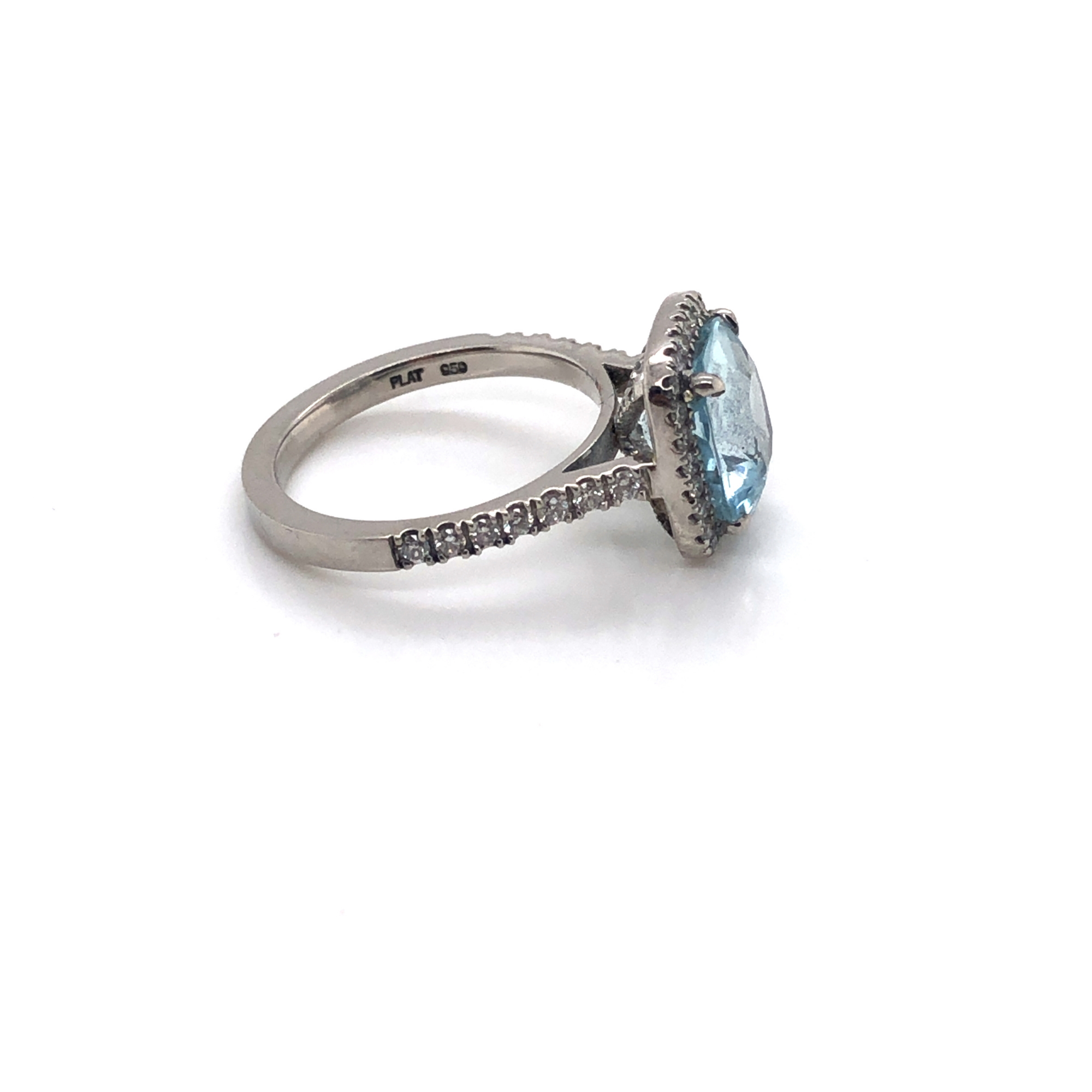 A CUSHION CUT AQUAMARINE AND DIAMOND HALO RING. THE SHANK STAMPED PLAT 950, AND ASSESSED AS - Image 5 of 7