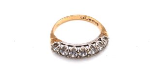 A 9ct YELLOW GOLD HALLMARKED SEVEN STONE CUBIC ZIRCONIA HALF ETERNITY RING. DATED 1982, LONDON.