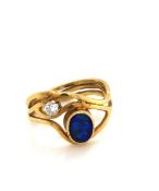 AN 18ct YELLOW GOLD HALLMARKED OPAL AND DIAMOND WAVE RING. THE OVAL OPAL TRIPET APPROX 7 x 6mm,