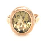 A 9ct YELLOW GOLD HALLMARKED LEMON QUARTZ RUB OVER SET RING. FINGER SIZE O. WEIGHT 5.46grms.