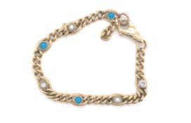 A 9ct GOLD MABE PEARL, PASTE AND BLUE STONE FANCY CURB BRACELET. UNHALLMAKRED. THE SOLDERED JUMP