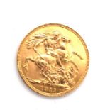 A 1911 22ct GOLD FULL SOVEREIGN COIN. 8grms.
