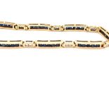 A SAPPHIRE AND DIAMOND PANEL LINE BRACELET. THE BRACELET SET WITH FORTY BRILLIANT CUT SAPPHIRES