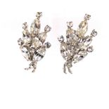 A PAIR OF VINTAGE "MAKE WOMEN FEEL SPECIAL" RHINESTONE CLIP ON EARRINGS BY SHERMAN, SIGNED TO CLIP