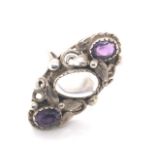 A VINTAGE MOONSTONE AND AMETHYST FOLIATE ART NOUVEAU STYLE RING. UNHALLMARKED AND ASSESSED AS