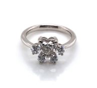 A PLATINUM HALLMARKED DIAMOND ANIMAL PAW PRINT RING. THE STYLISED PAWPRINT WITH PRINCIPLE HEART