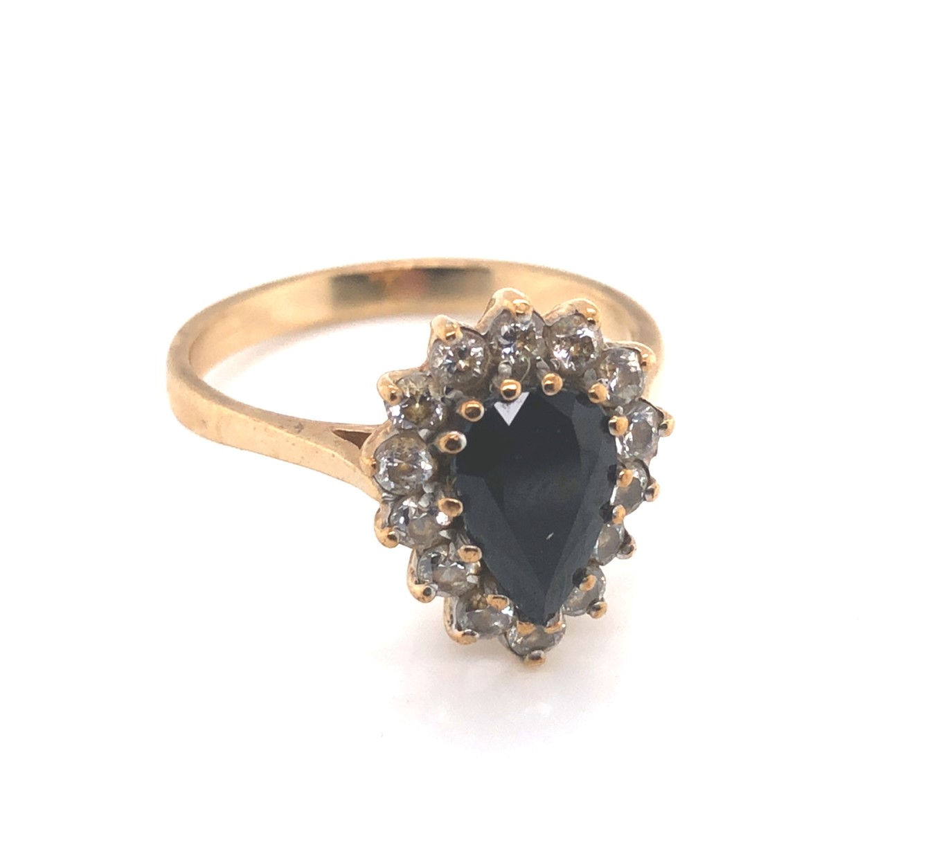 A 9ct HALLMARKED GOLD DARK BLUE SAPPHIRE PEAR CUT CLUSTER RING. THE SAPPHIRE SURROUNDED BY A CLUSTER