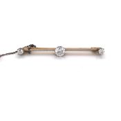 AN ANTIQUE THREE STONE REPLACEMENT CUBIC ZIRCONIA BAR BROOCH, COMPLETE WITH SAFETY CHAIN.