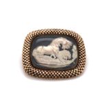 AN ANTIQUE CRYSTAL SULPHIDE INTAGLIO BROOCH DEPICTING A HORSE AND LION SCENE AFTER GEORGE STUBBS. T