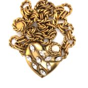 A VINTAGE BUTLER AND WILSON COSTUME HEART PENDANT NECKLACE. THE HEART SET WITH FAUX PEARLS AND