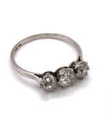 AN ANTIQUE PLATINUM AND THREE STONE OLD CUT DIAMOND RING. THE THREE GRADUATED OLD CUTS EACH IN A SIX