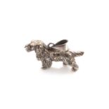 A DIAMOND SET VINTAGE SPANIEL PENDANT. THE BODY OF THE SPANIEL SET WITH ELEVEN DIAMONDS AND THE HEAD