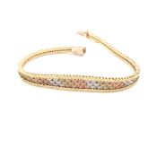 A VINTAGE THREE COLOUR RED, YELLOW AND WHITE BRICK STYLE GRADUATED BRACELET. THE CLASP STAMPED 9kt
