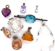 A GROUP OF NINE VARIOUS CUT CRYSTAL AND OTHER STONE SET PENDANTS, A FOB, AND A BAR BROOCH (NINE).