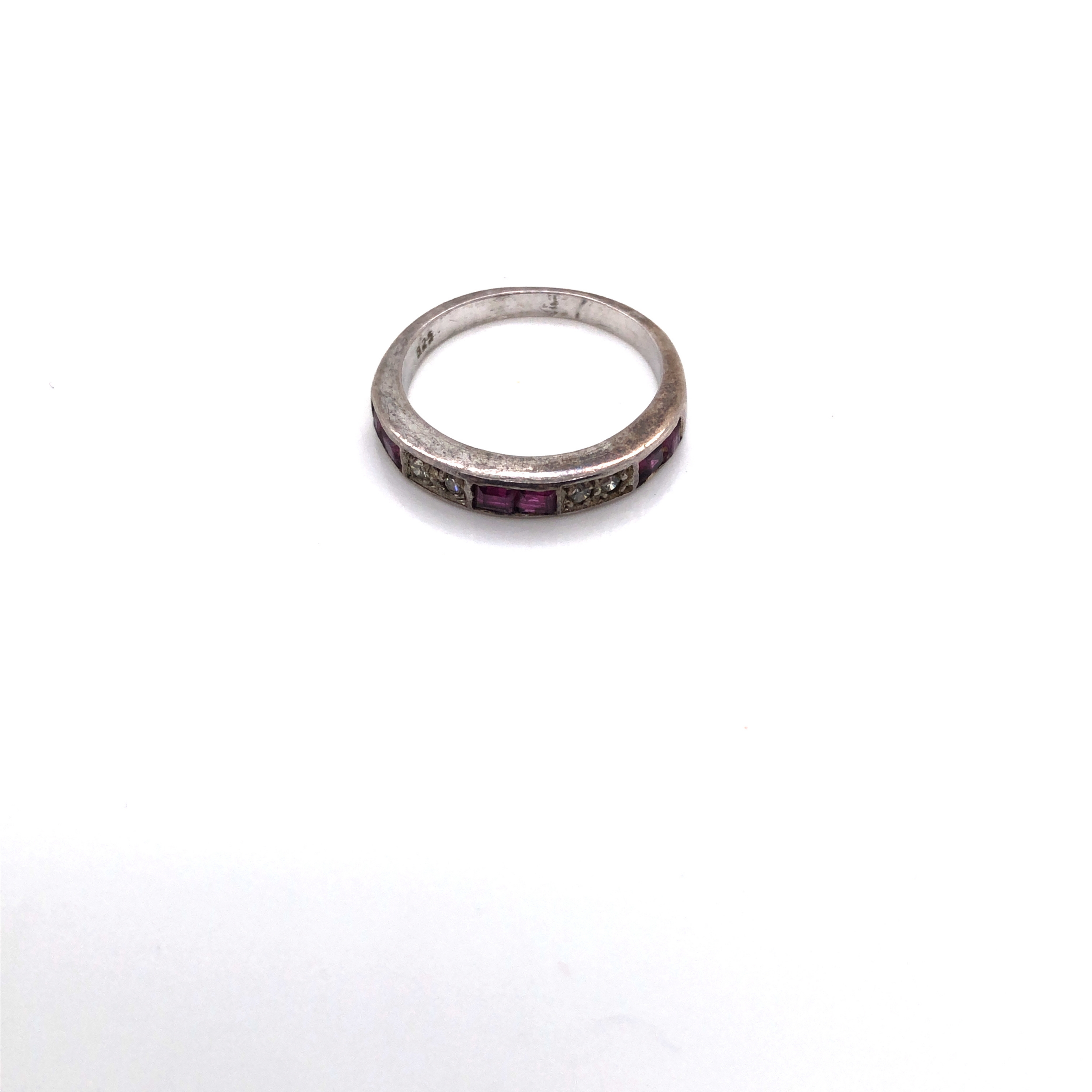 A VINTAGE RUBY AND CUBIC ZIRCONIA CHANNEL SET HALF ETERNITY RING SHANK STAMPED 925 AND ASSESSED AS - Image 2 of 2