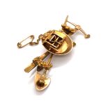 AN INTERESTING MINERS BROOCH. THE BROOCH WITH CROSSED SHOVEL AND PICK UNDER GOLD PAN AND GOLD