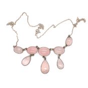 A VINTAGE ROSE QUARTZ MULTI DROP EIGHT STONE NECKLACE. UNHALLMARKED AND ASSESSED AS SILVER. NECKLACE