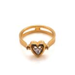 A DIAMOND SET HEART SHAPE SPINNER RING. UNHALLMARKED STAMPED 18ct AND ASSESSED AS 18ct YELLOW