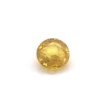 A ROUND MIXED CUT BRIGHT YELLOW SAPPHIRE. APPROX MEASUREMENTS 6.68mm x 4.00mm. APPROX CARAT WEIGHT