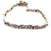 A GEMSET BRACELET, SET WITH OVAL FACET CUT EMERALDS, SAPPHIRES AND RUBIES. UNHALLMARKED AND ASSESSED