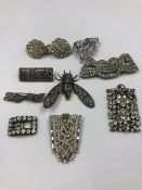 A GROUP OF NINE ANTIQUE AND LATER PASTE SET BROOCHES, DRESS CLIPS, BUCKLE AND PENDANT TO INCLUDE
