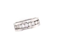 A DIAMOND HALF ETERNITY WIDE BAND. THE INNER BAND WITH FIFTEEN OLD CUT DIAMONDS INDIVIDUALLY SET