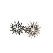 TWO ANTIQUE PASTE SET STAR BURST BROOCHES ONE WITH FLARED RAYS THE OTHER WITH ATTACHED SAFETY CHAIN.