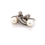 A PAIR OF VINTAGE MIKIMOTO CULTURED AKOYA PEARL AND SILVER SCREW BACK EARRINGS COMPLETE WITH