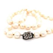 A PRINCESS STRING OF VINTAGE FRESHWATER CULTURED BAROQUE PEARLS COMPLETE WITH A PASTE CLASP,