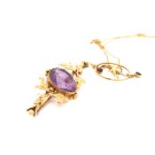 A 9ct GOLD EDWARDIAN AMETHYST FOLIATE PENDANT AND CHAIN. CHAIN LENGTH 36cms, PENDANT LENGTH