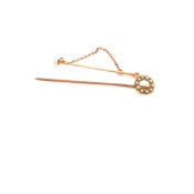 TWO VINTAGE 15ct YELLOW GOLD AND PEARL STAMPED STICK PINS. THE WREATH PIN CLEARLY STAMPED 15ct,