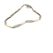 A 9ct YELLOW GOLD HALLMARKED CUBIC ZIRCONIA SET LINE BRACELET. LENGTH 18.5cms. WEIGHT 5.54grms.