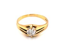 A VINTAGE OLD CUT DIAMOND SINGLE STONE GYPSY RING. UNHALLMARKED AND ASSESSED AS 18ct, 750 GOLD.