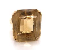 A VINTAGE CITRINE COCKTAIL RING. THE FANCY CUT CITRINE IN A RAISED DOUBLE FOUR CLAW SETTING. THE