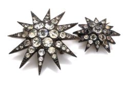 TWO ANTIQUE PASTE SET STAR BURST BROOCHES. THE LARGER BROOCH STAMPED 900, THE SMALLER BROOCH